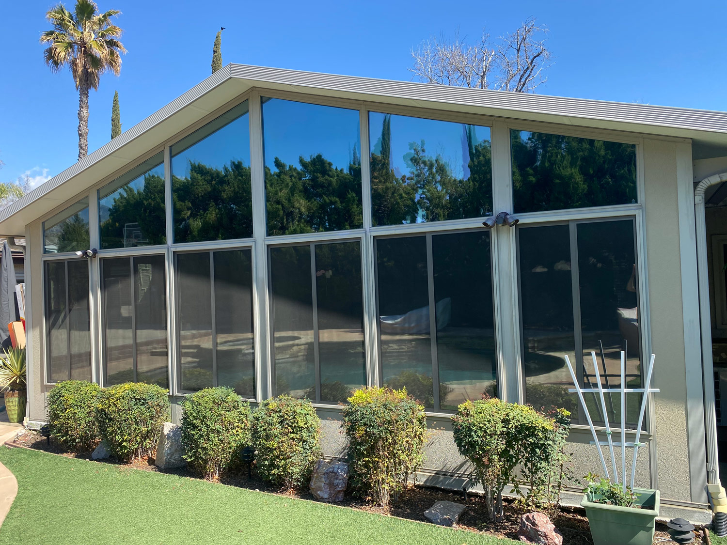 Exterior of residential home with nice tall ceilings and window tint